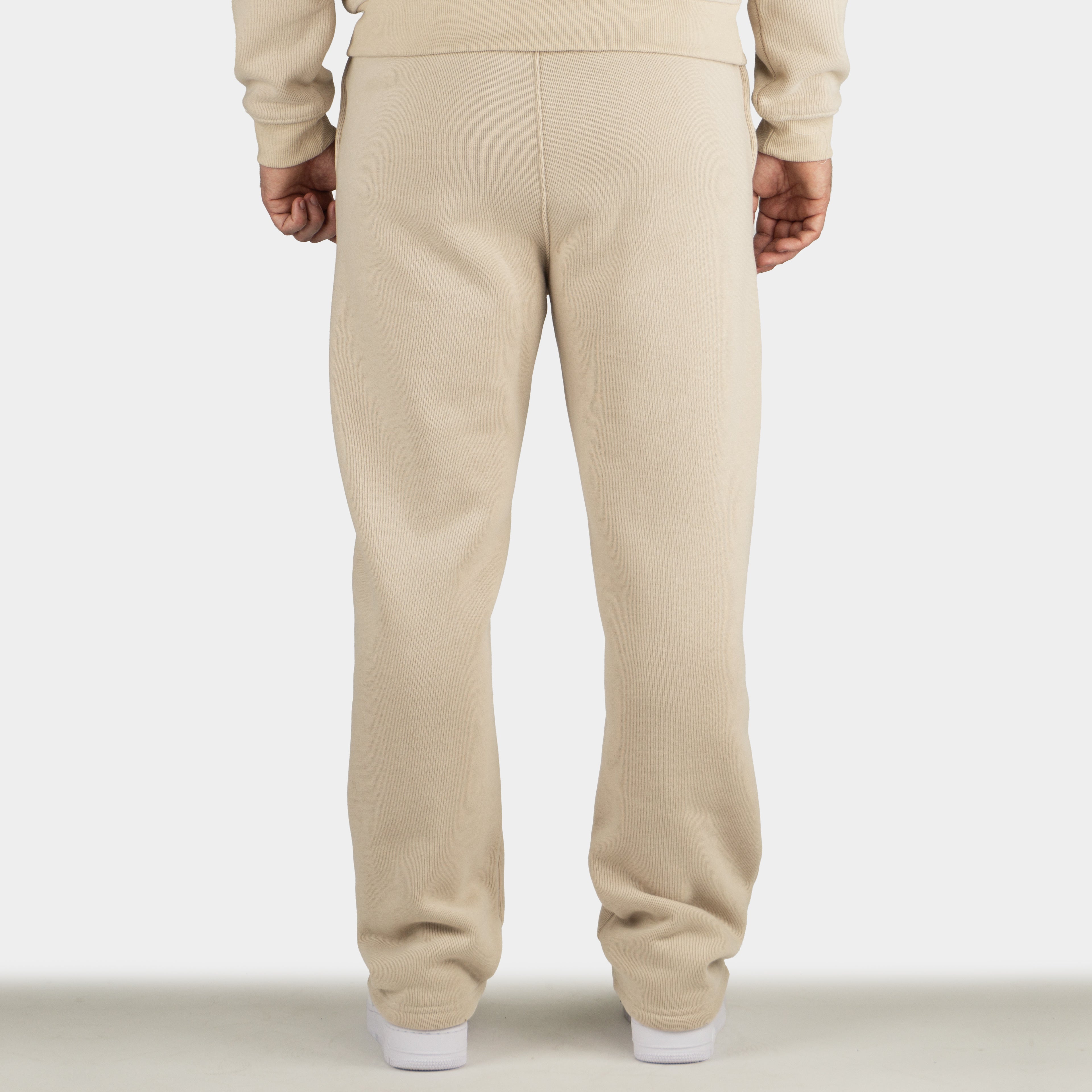 Beige men´s Baze Dessert flow pants - model back view