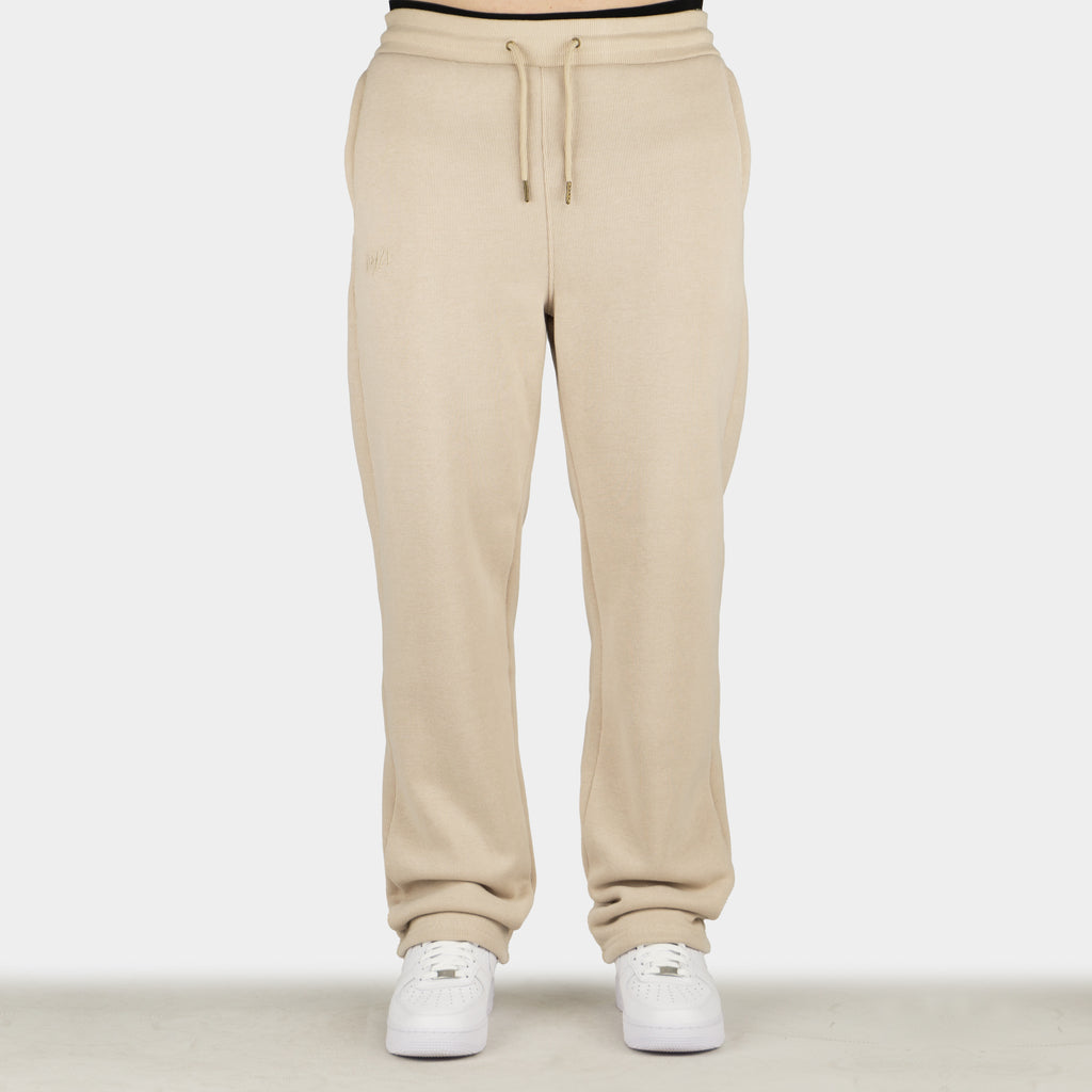 Beige men´s Baze Dessert flow pants - model front view