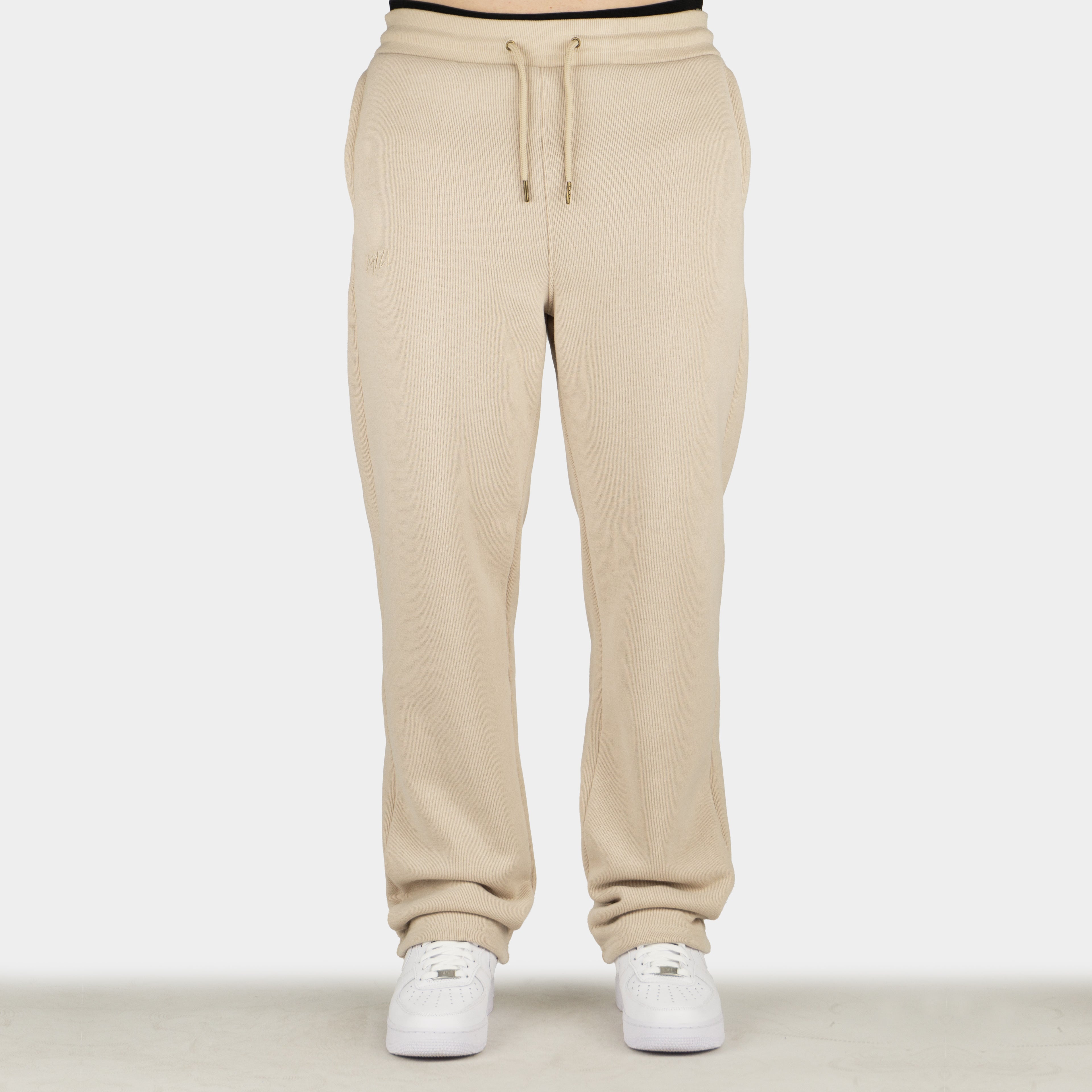 Beige men´s Baze Dessert flow pants - model front view
