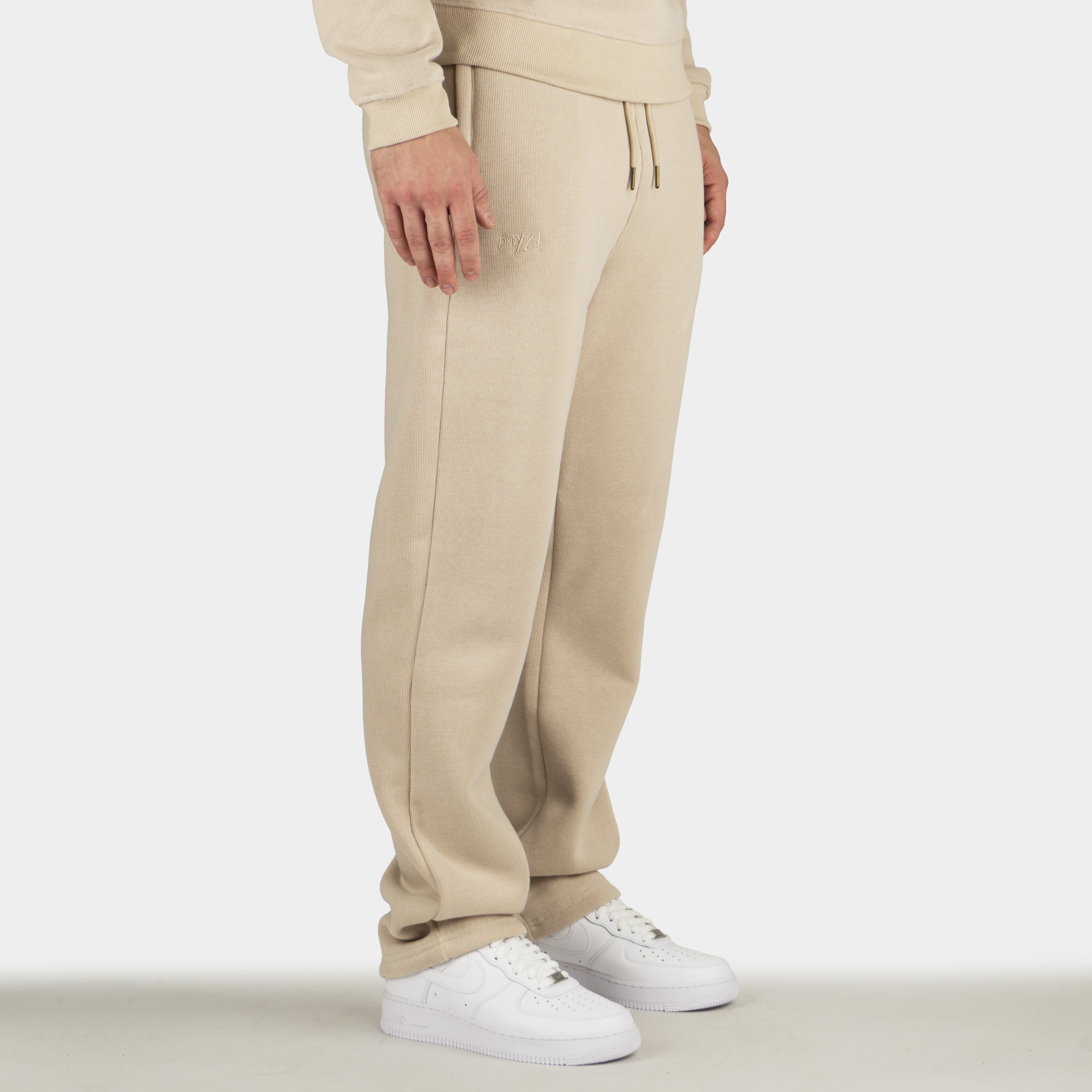 Beige men´s Baze Dessert flow pants - model side view