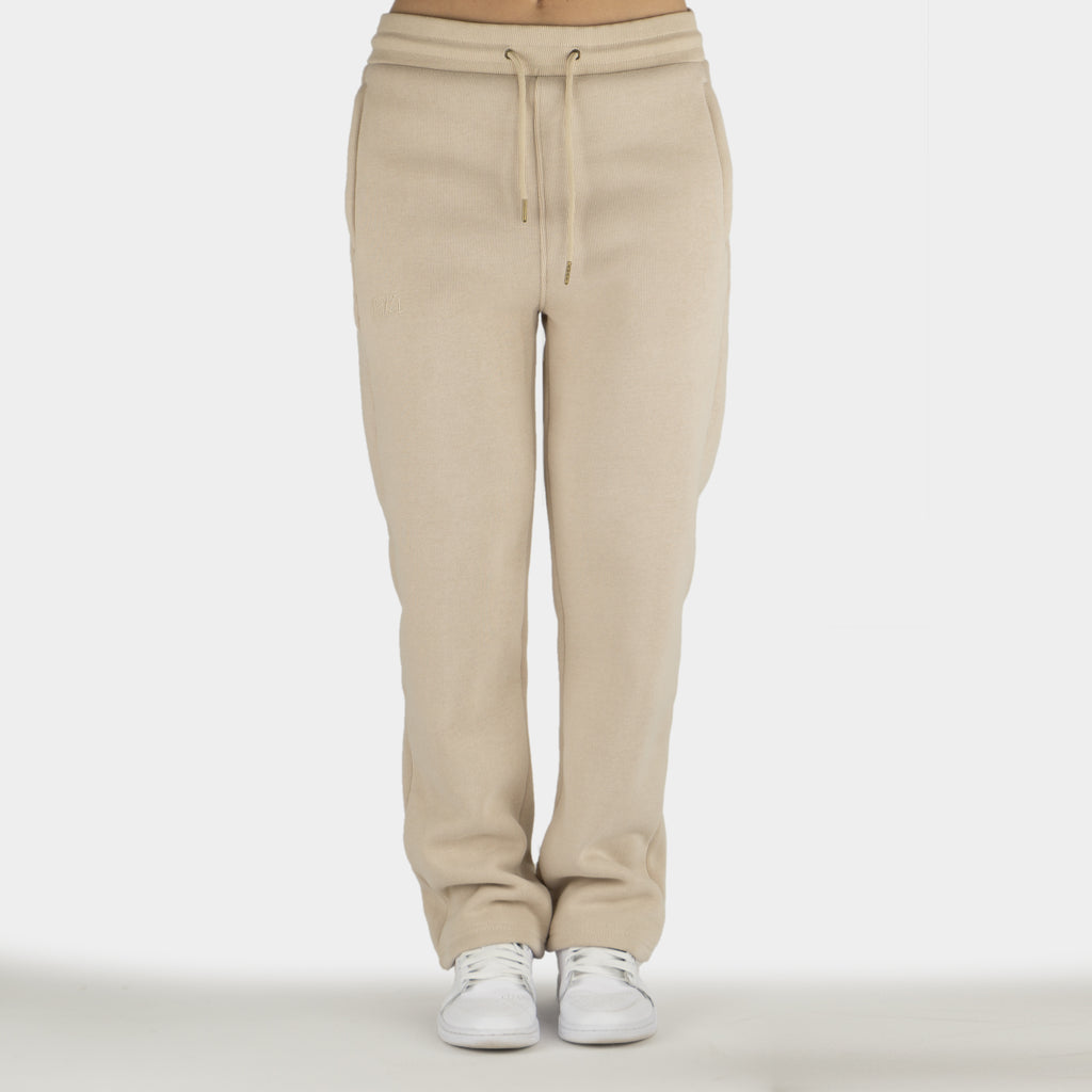 Beige women´s Baze Dessert flow pants - model front view