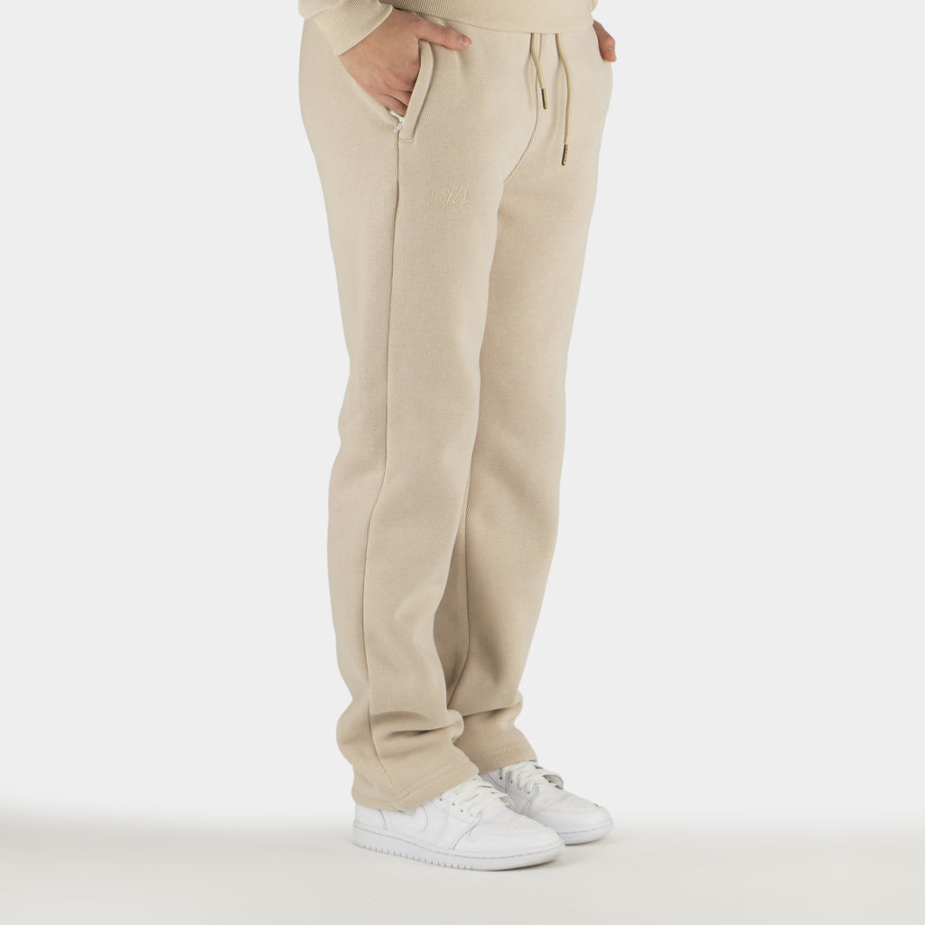 Beige women´s Baze Dessert flow pants - model side view