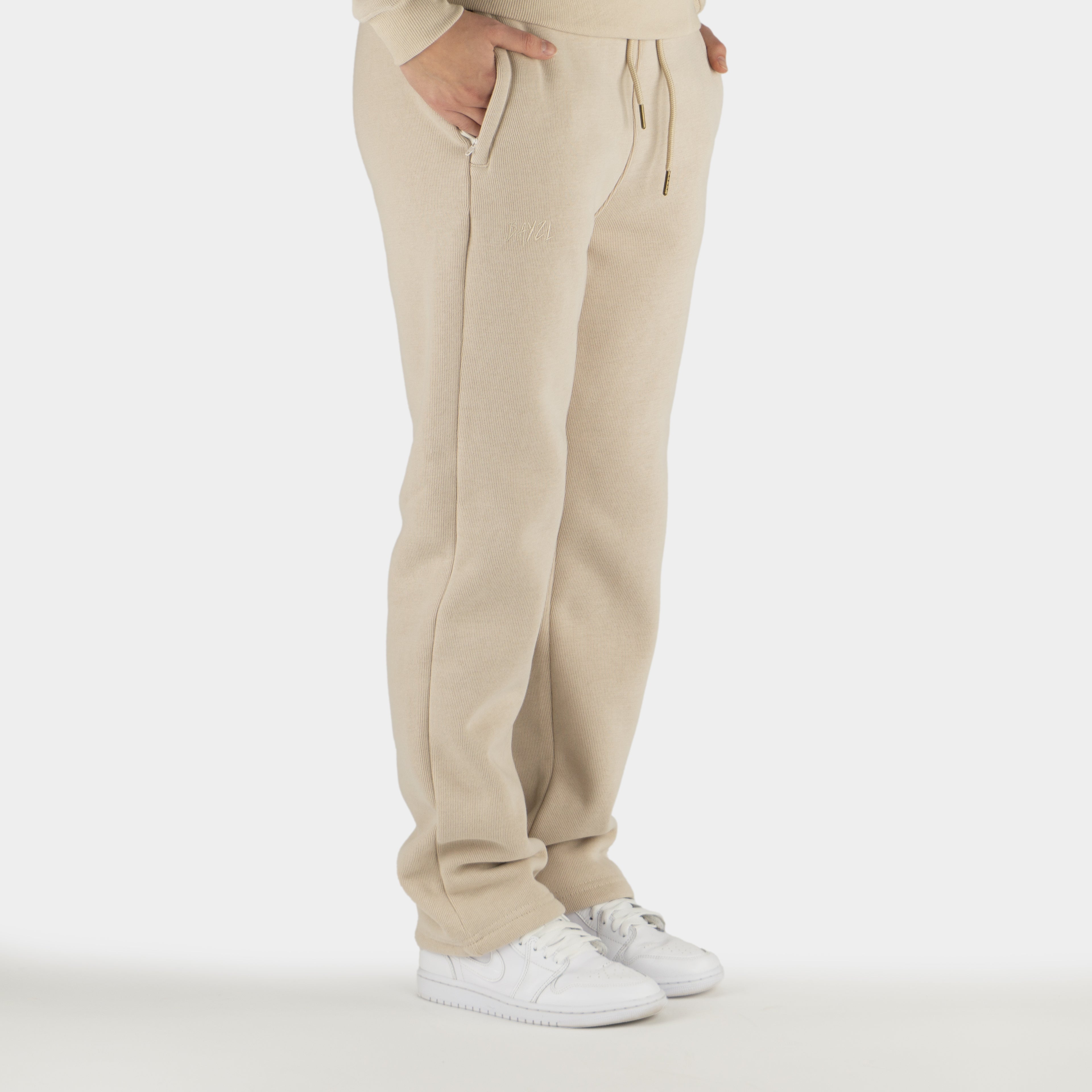 Beige women´s Baze Dessert flow pants - model side view