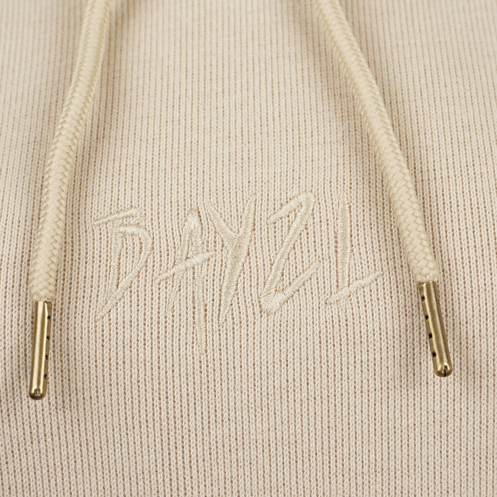 Beige women’s Baze Dessert hoodie – front logo view