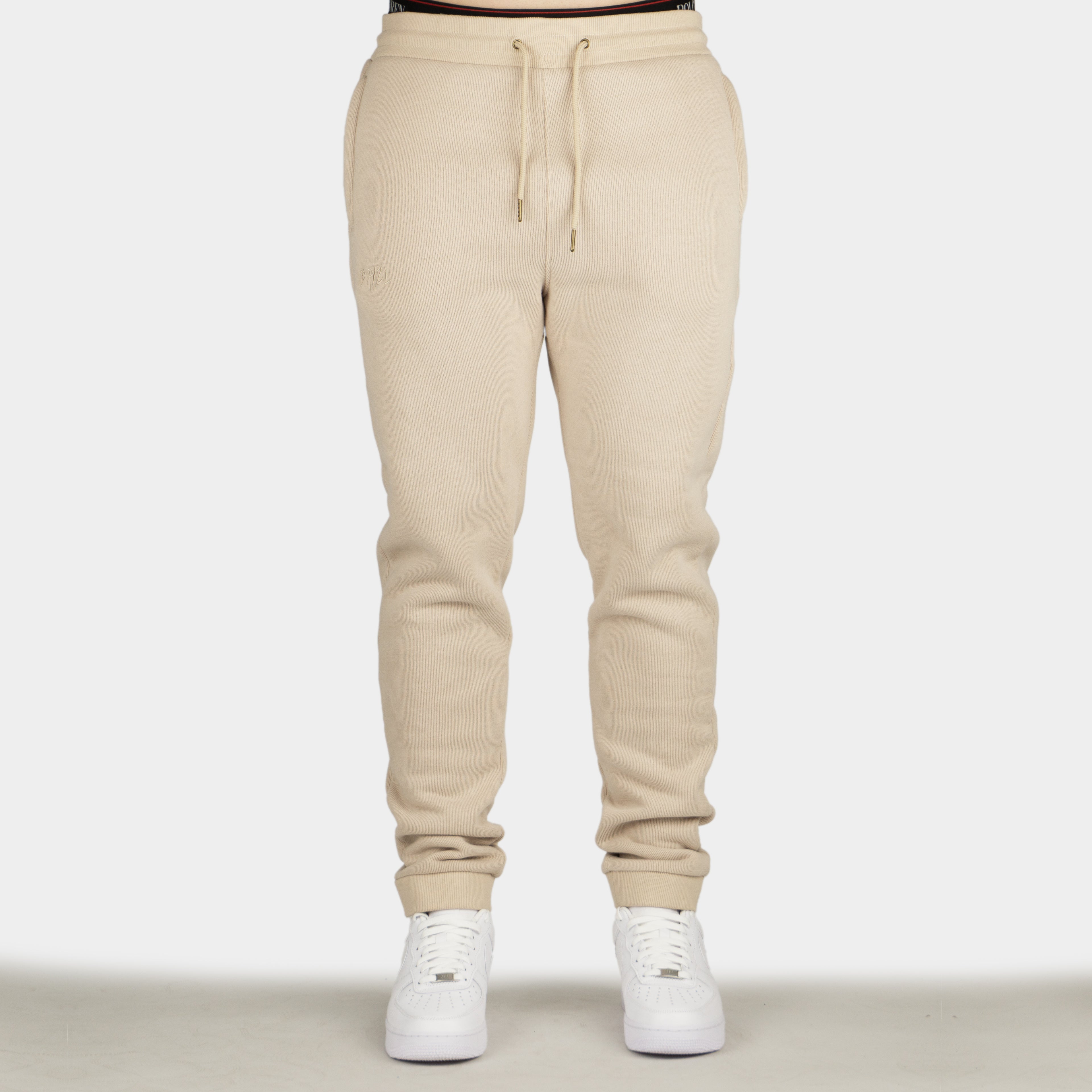 Beige men´s Baze Dessert lock pants - model front view