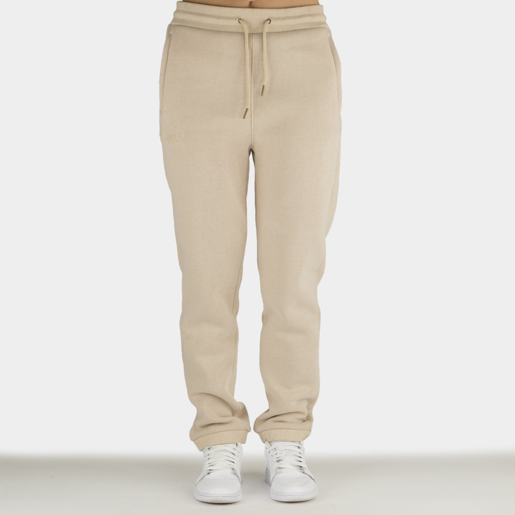 Beige women´s Baze Dessert lock pants - model front view