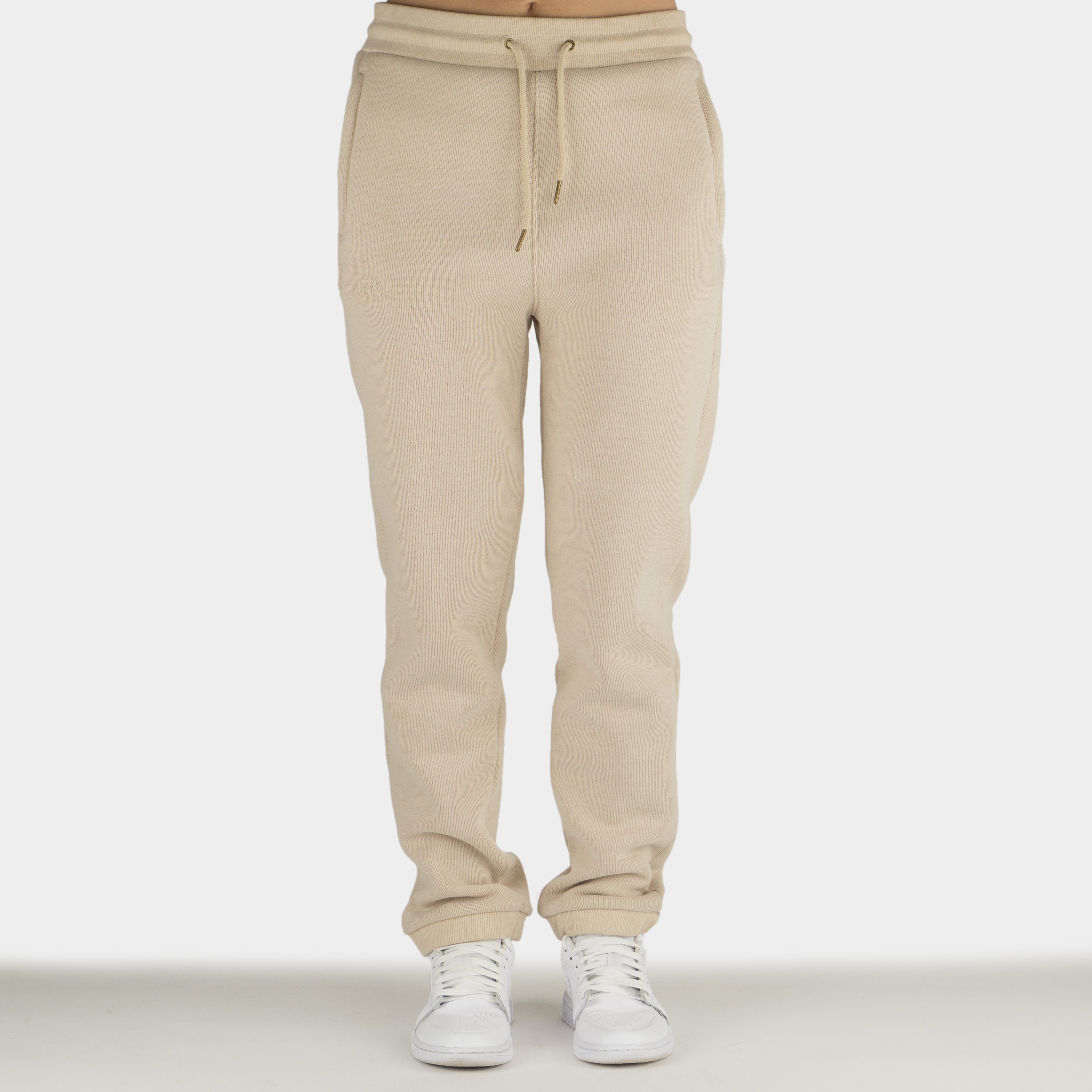 Beige women´s Baze Dessert lock pants - model front view