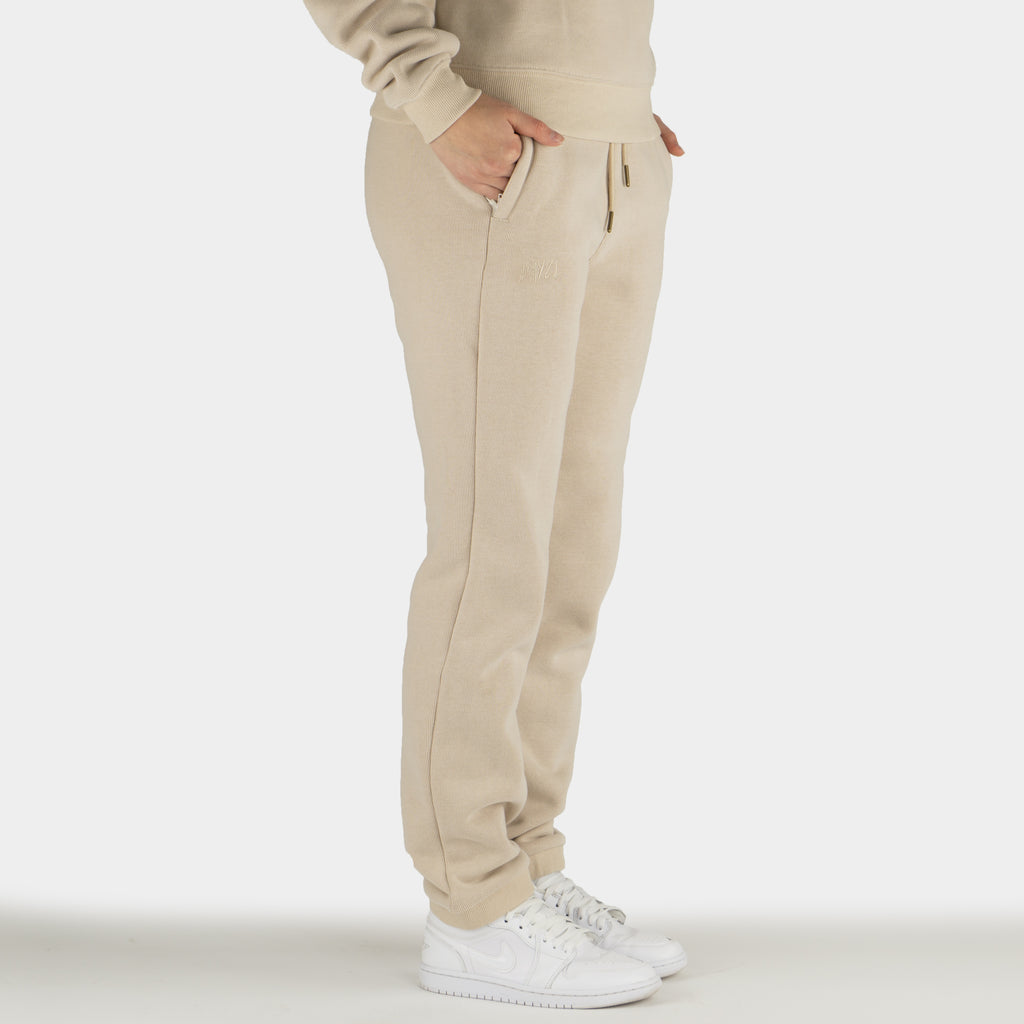 Beige women´s Baze Dessert lock pants - model side view
