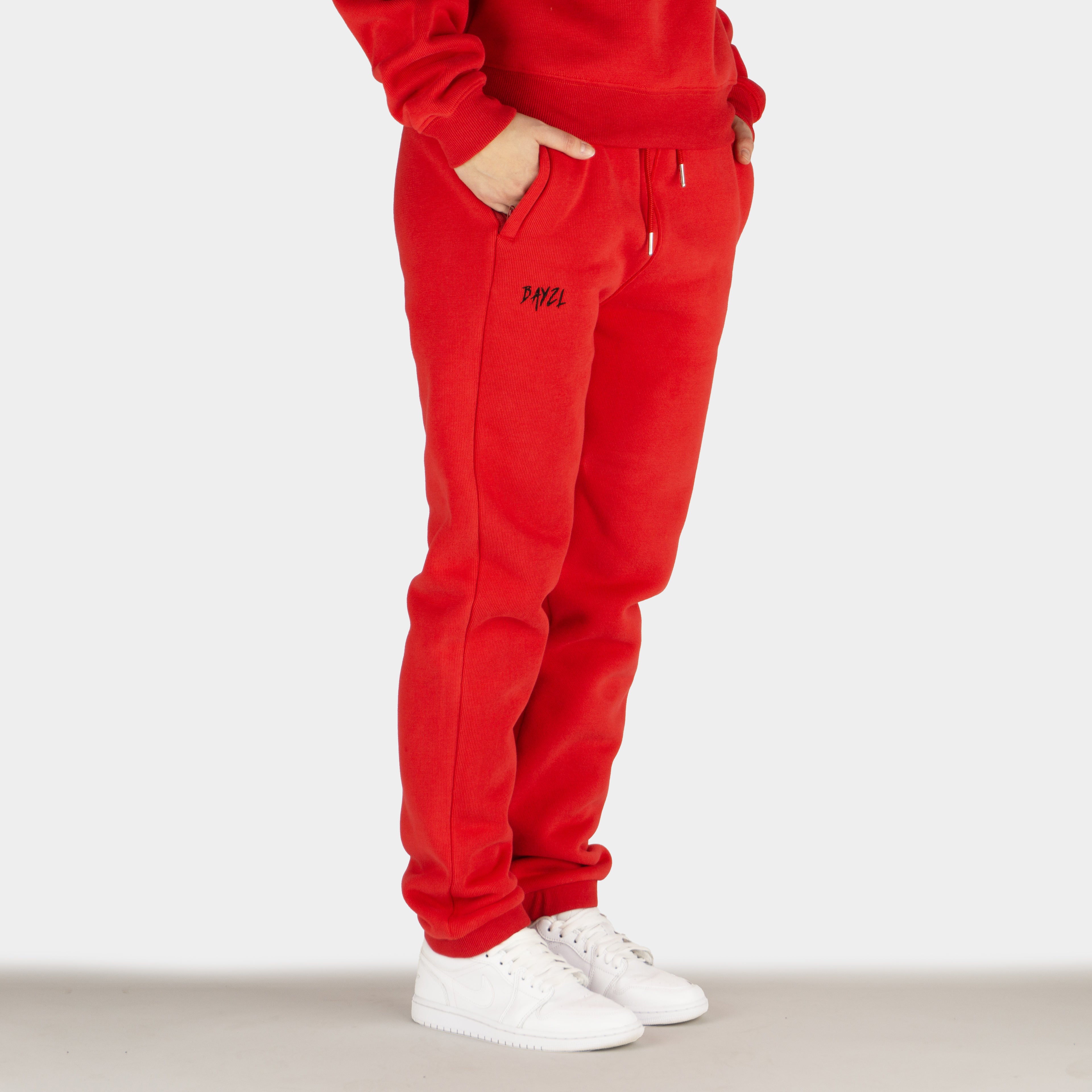 Red women´s Baze Ember lock pants - model side view