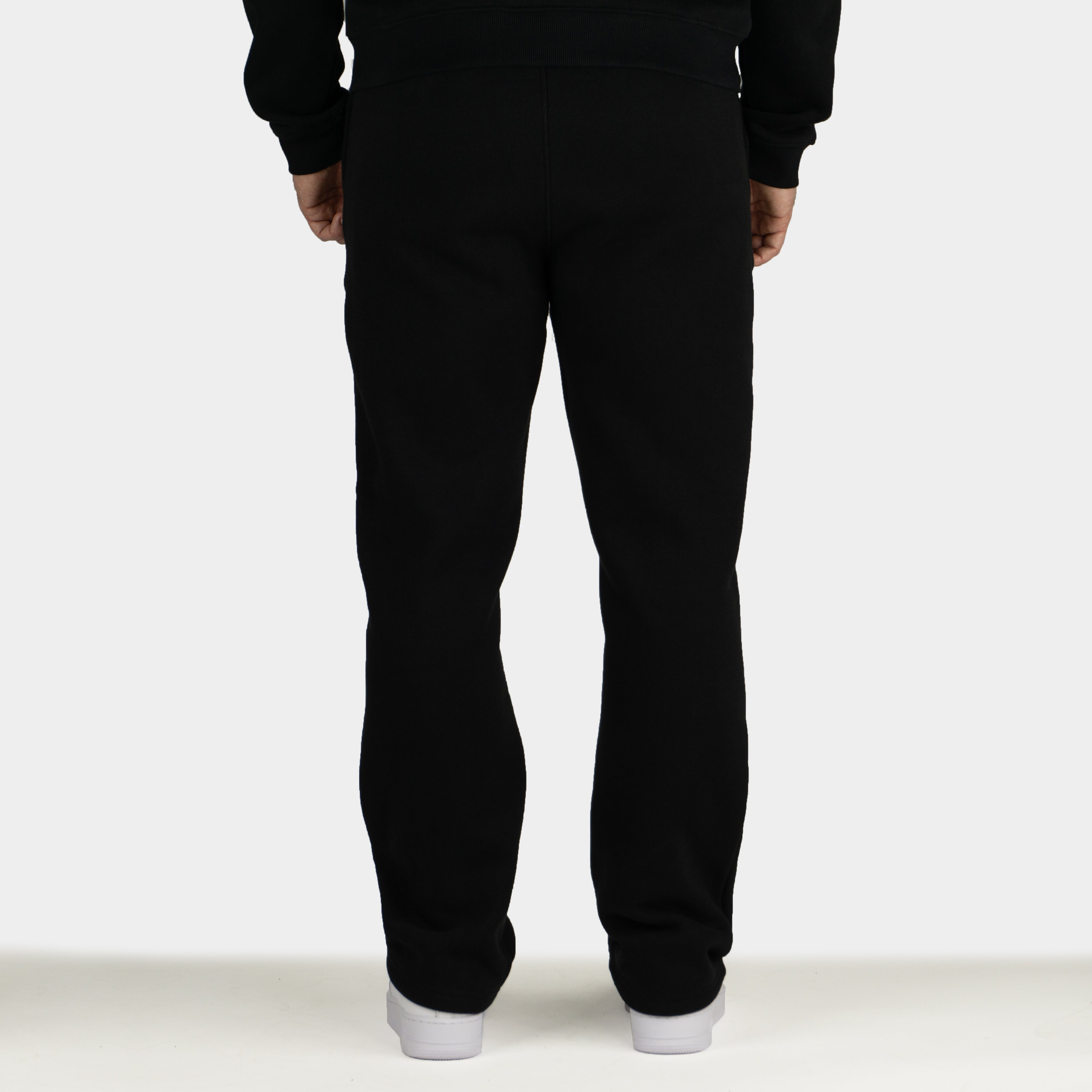 Black men´s Baze Midnight flow pants - model back view